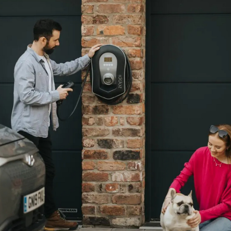 Image of the MyEnergi Zappi charger in use, with an electric vehicle plugged in and charging.